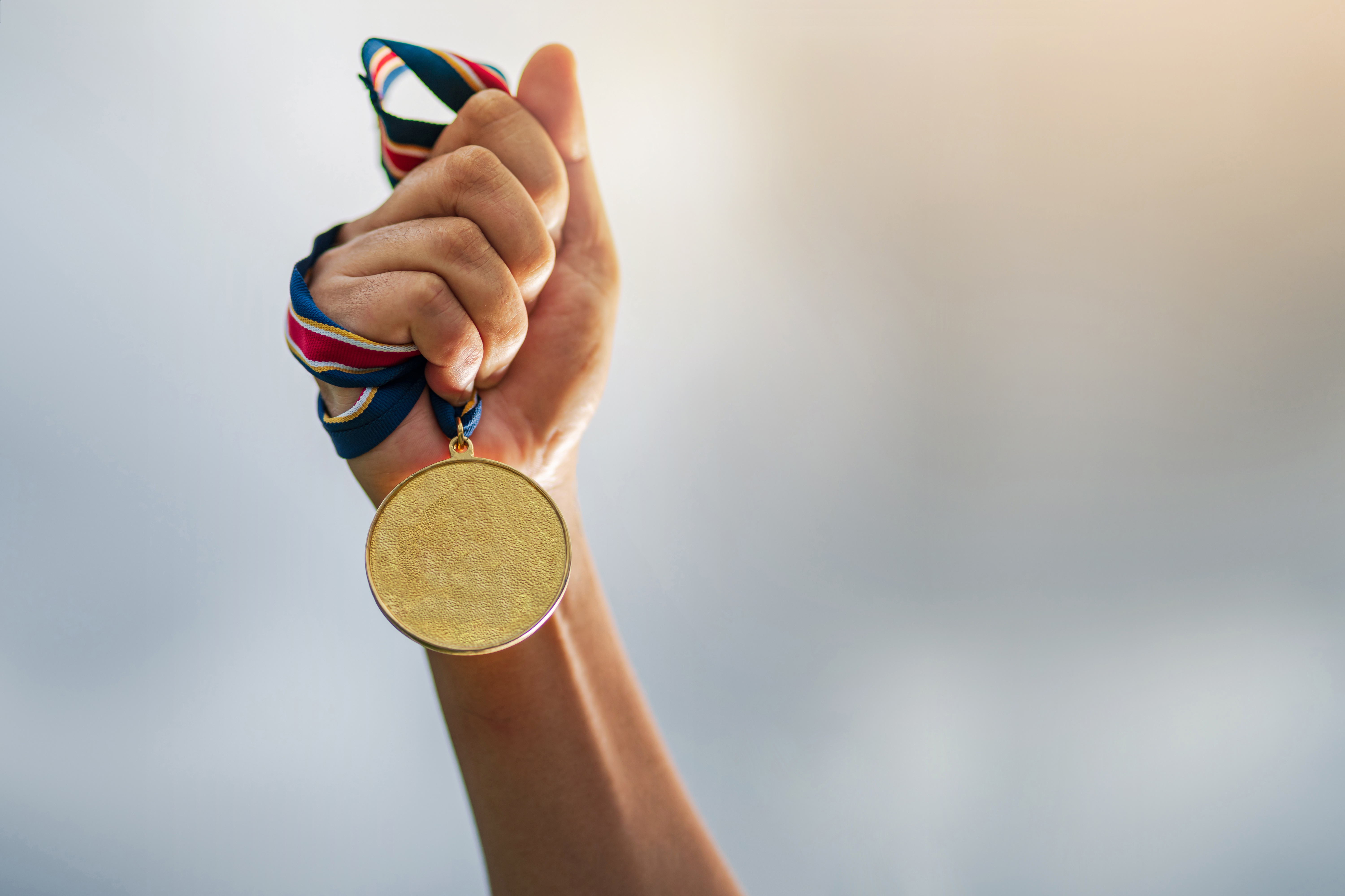 Olympic gold medal lapel pin